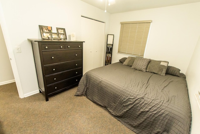 carpeted bedroom with a closet