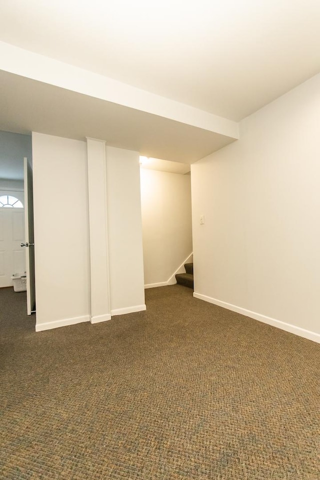 basement with dark colored carpet