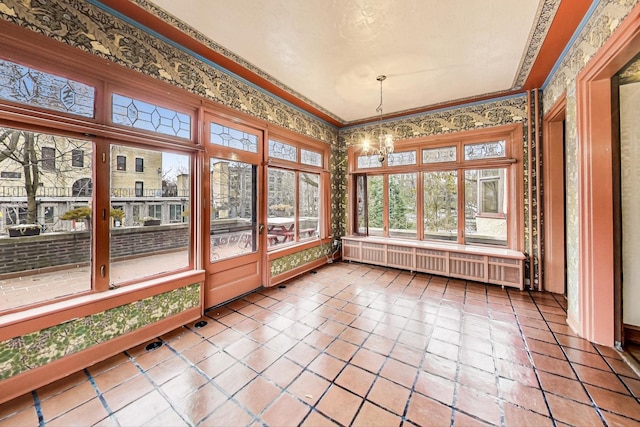 unfurnished sunroom featuring radiator