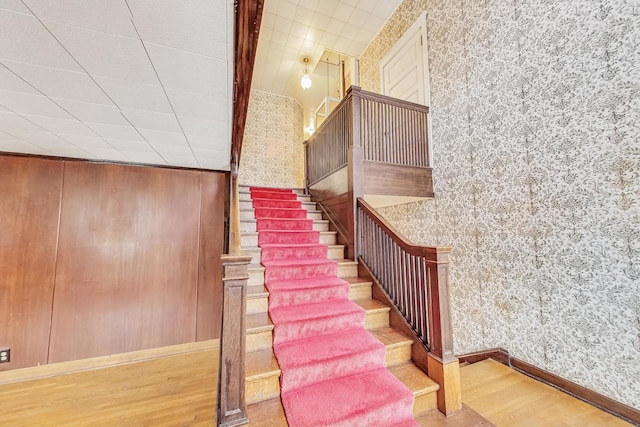 stairway featuring hardwood / wood-style floors