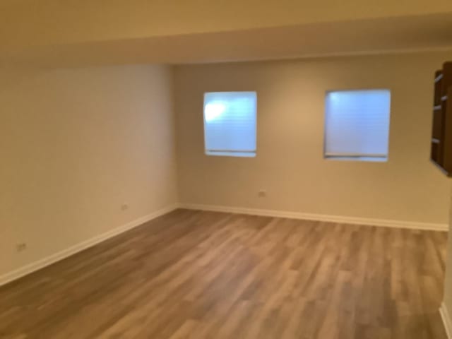 empty room featuring hardwood / wood-style flooring