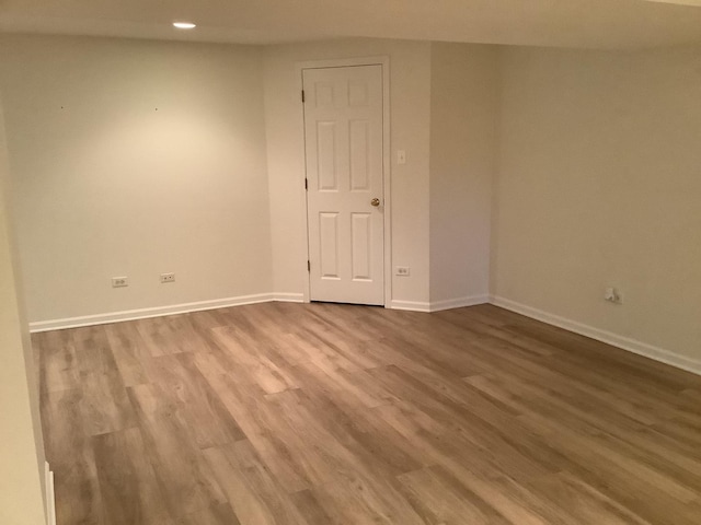 empty room with hardwood / wood-style floors