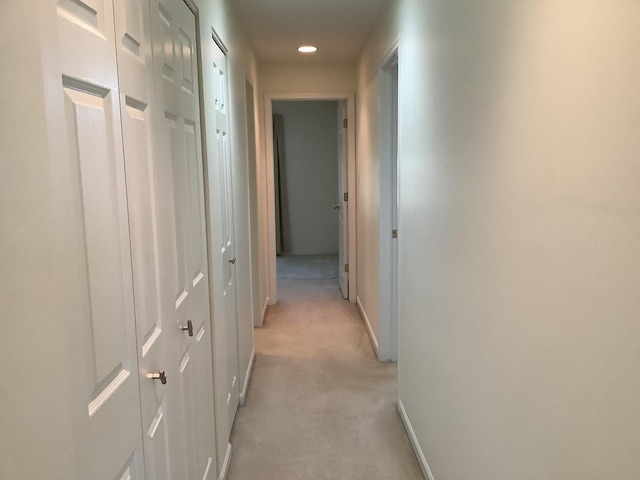 hallway with light carpet