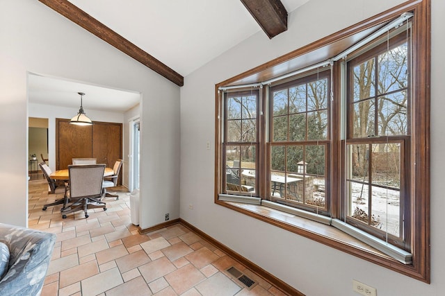 interior space featuring lofted ceiling with beams and a wealth of natural light