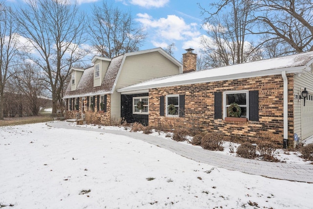 view of snow covered property