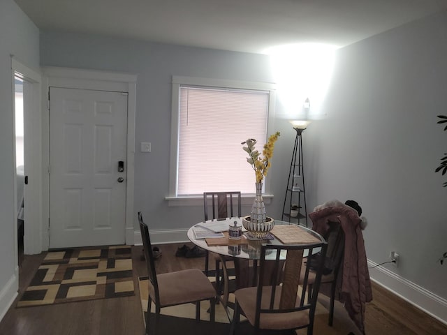 dining space featuring dark hardwood / wood-style flooring