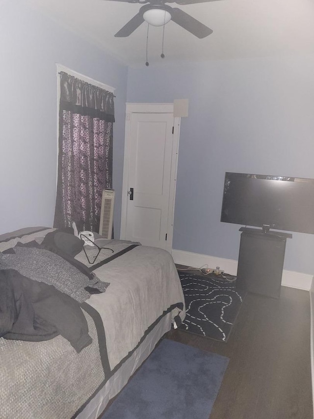 bedroom featuring hardwood / wood-style flooring and ceiling fan