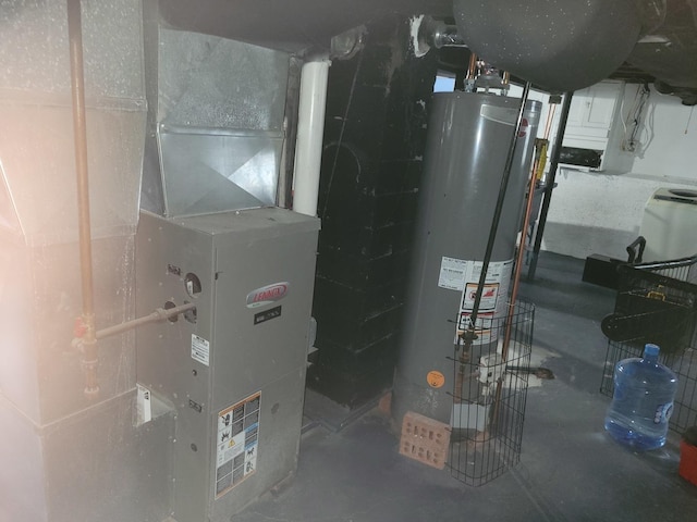 utility room featuring gas water heater and heating unit