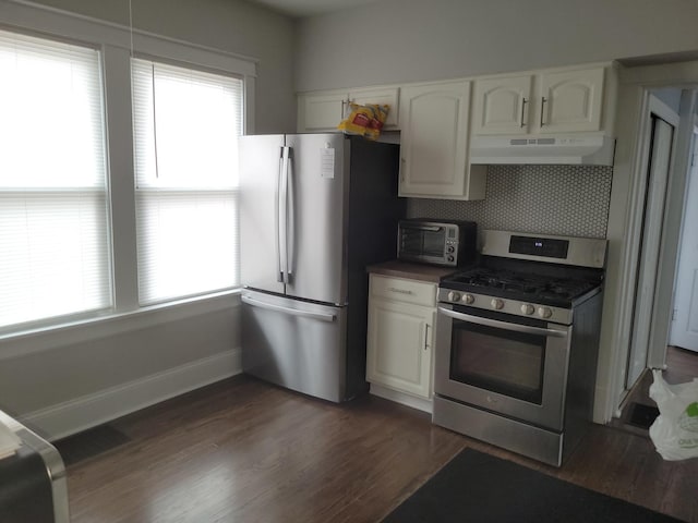 kitchen featuring white cabinetry, dark hardwood / wood-style floors, decorative backsplash, and stainless steel appliances