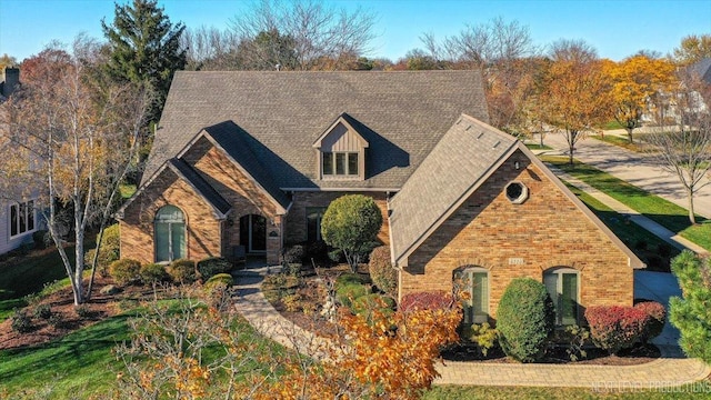 view of front facade featuring brick siding