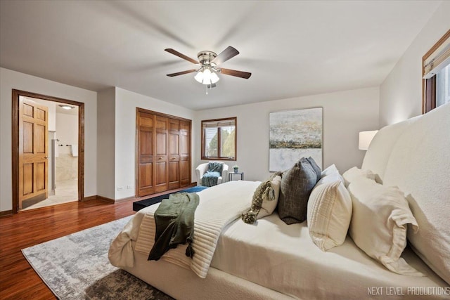 bedroom featuring ceiling fan, a closet, wood finished floors, and baseboards