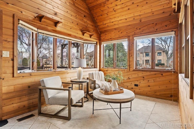 sunroom with visible vents and vaulted ceiling