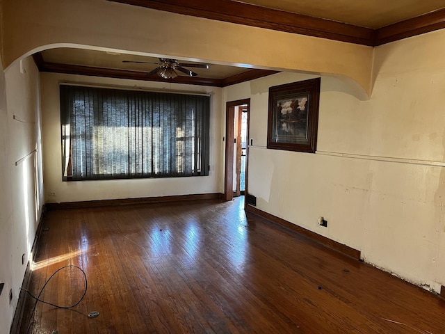 unfurnished room featuring crown molding, ceiling fan, and dark hardwood / wood-style flooring