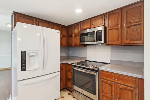 kitchen with stainless steel appliances and light tile patterned floors