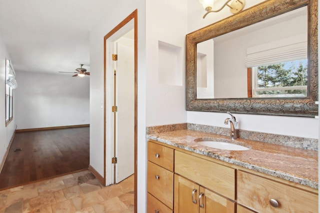 bathroom with vanity and ceiling fan