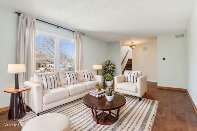 living room with dark hardwood / wood-style flooring