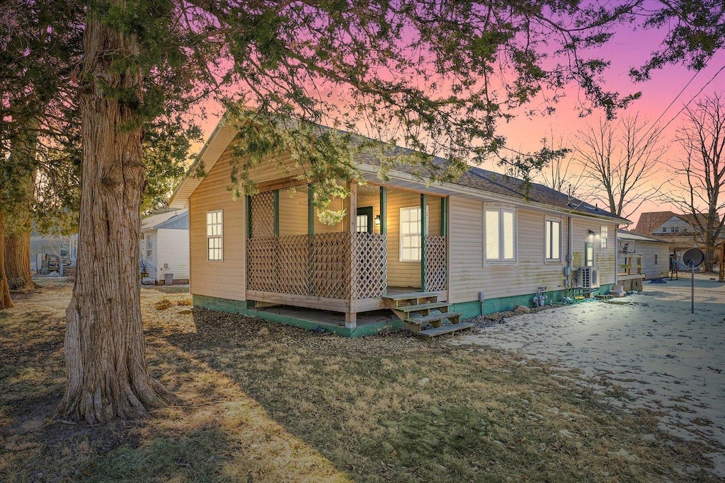 view of property exterior at dusk