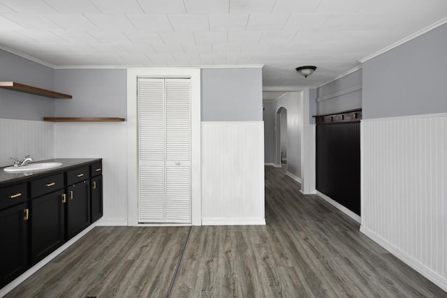 kitchen featuring sink, crown molding, and dark hardwood / wood-style floors