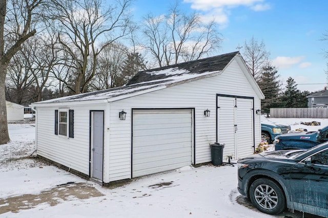 view of snow covered garage