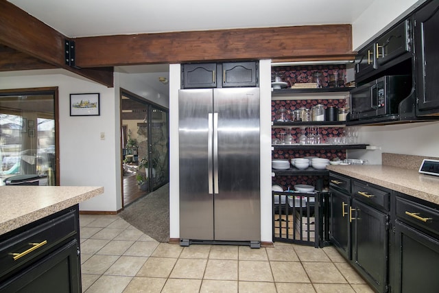 kitchen featuring stainless steel fridge and light tile patterned flooring