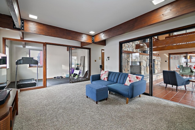 living room with beam ceiling and carpet