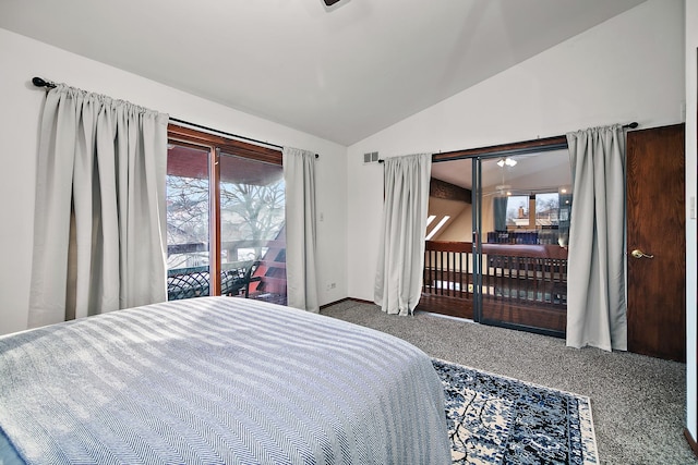 bedroom with vaulted ceiling, carpet floors, and access to exterior