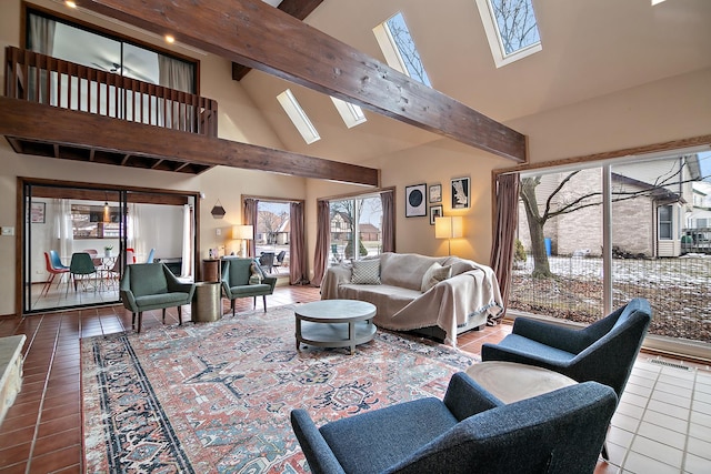 tiled living room with beamed ceiling, high vaulted ceiling, and a skylight