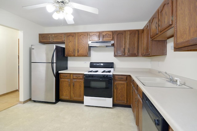 kitchen featuring dishwashing machine, sink, stainless steel fridge, ceiling fan, and range with gas cooktop