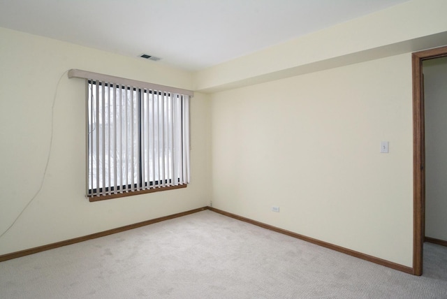 spare room with light colored carpet