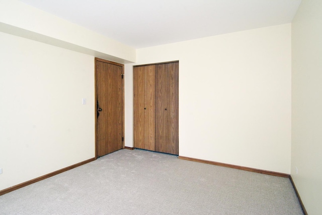 empty room featuring light carpet