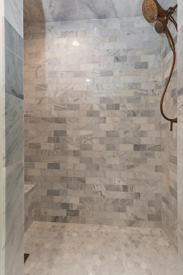 bathroom with a tile shower