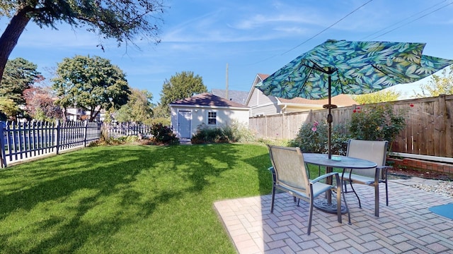 view of yard with an outdoor structure and a patio area