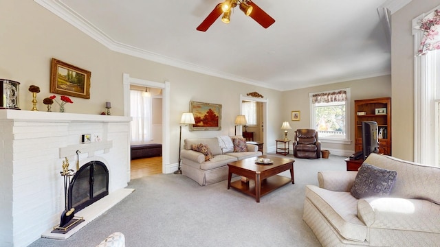 living room featuring ornamental molding, a brick fireplace, and light colored carpet