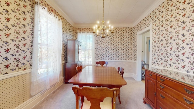 dining area with crown molding, light colored carpet, and a notable chandelier