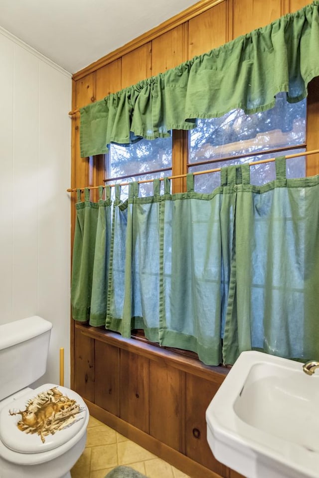 bathroom with tile patterned flooring, sink, and toilet