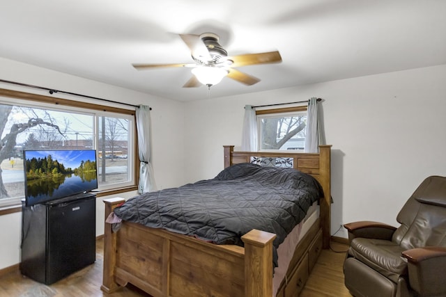 bedroom featuring ceiling fan and light wood-type flooring