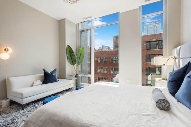 bedroom featuring a wall of windows