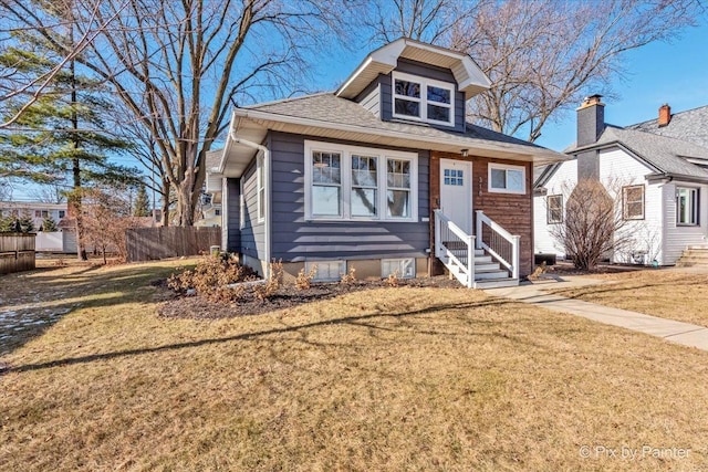 bungalow-style home featuring a front yard