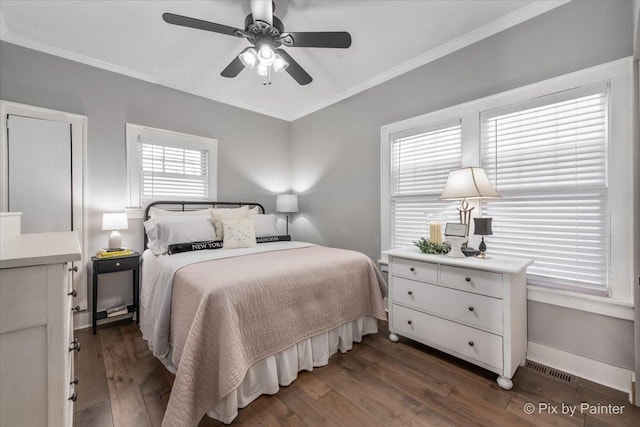 bedroom featuring ornamental molding, dark hardwood / wood-style floors, and ceiling fan