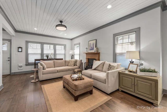 living room featuring a wealth of natural light, ornamental molding, and dark hardwood / wood-style floors