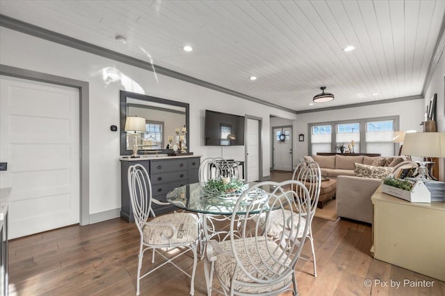 dining area with hardwood / wood-style floors, wood ceiling, and ornamental molding