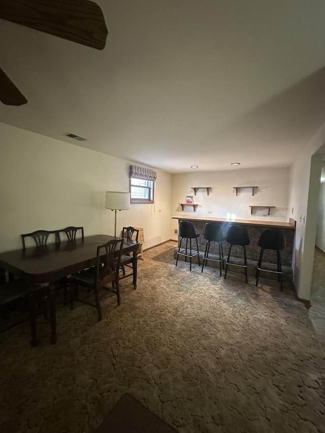 view of carpeted dining area