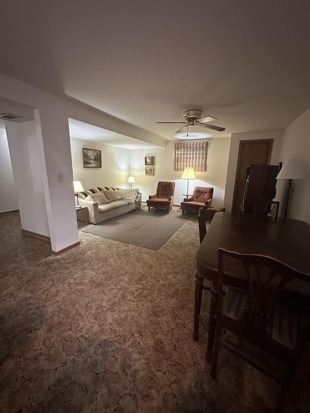 carpeted living room featuring ceiling fan