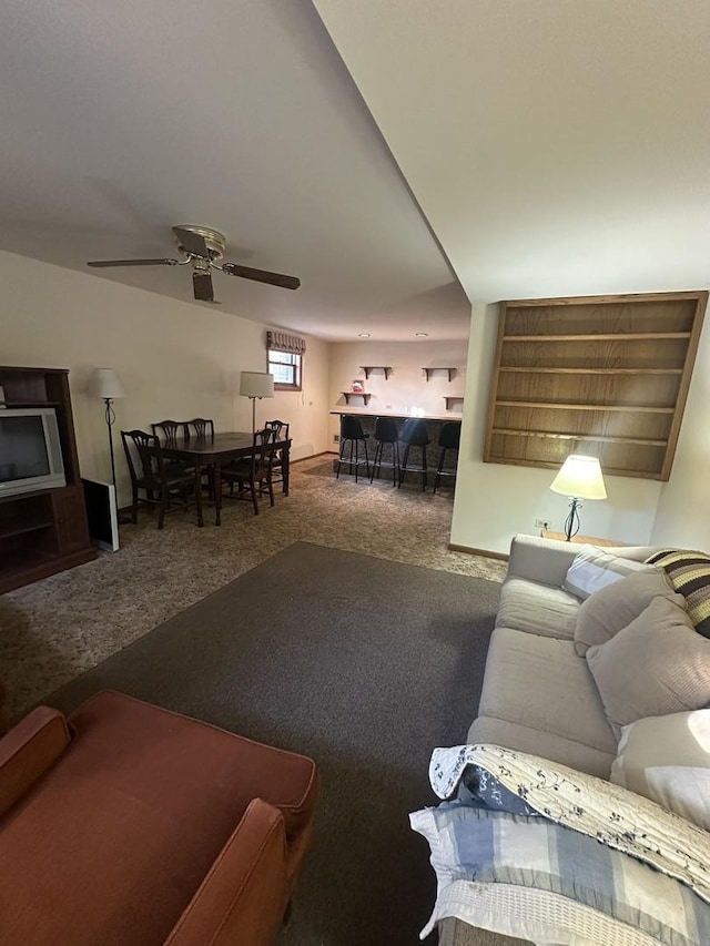 living room with carpet flooring and ceiling fan