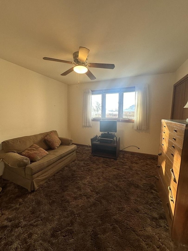 living room with dark carpet and ceiling fan