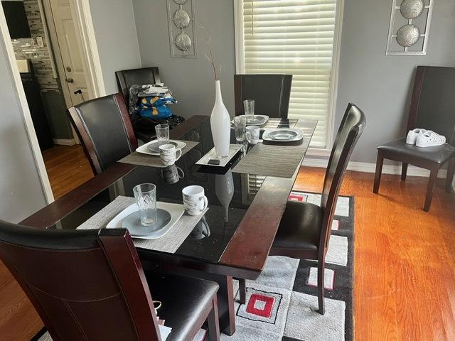 dining room with hardwood / wood-style flooring