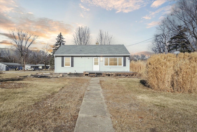 view of front of home with a lawn