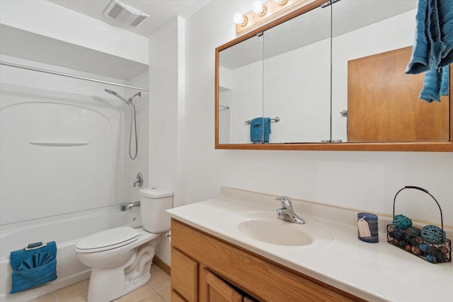 full bathroom featuring tile patterned floors, shower / washtub combination, toilet, a textured ceiling, and vanity