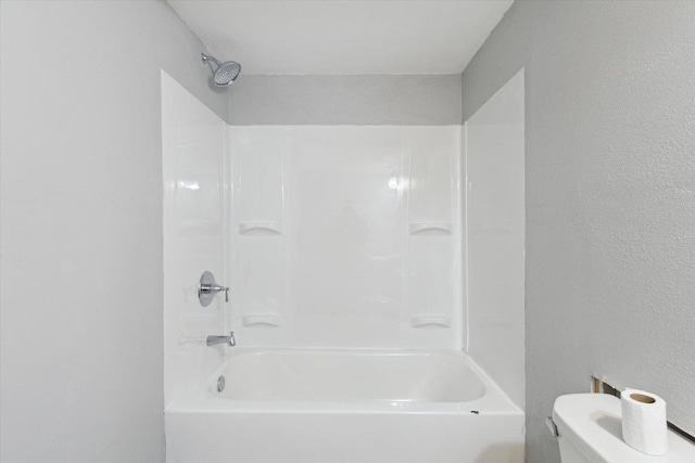 bathroom featuring toilet and shower / tub combination