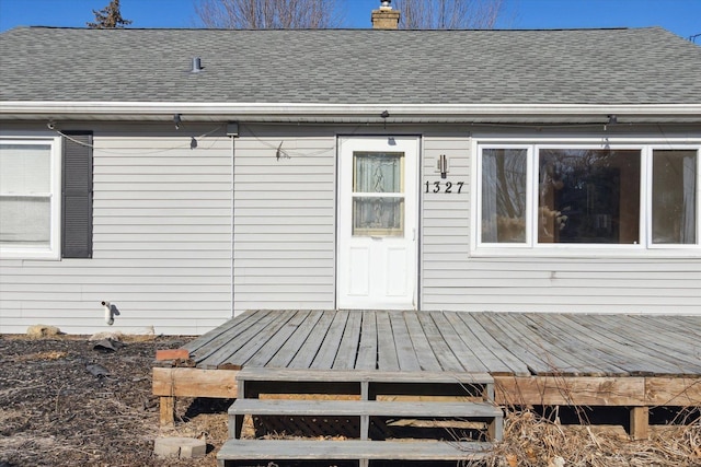 rear view of property with a wooden deck